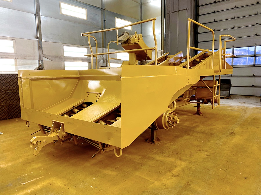 used etnyre chip speader in refinish bay photo